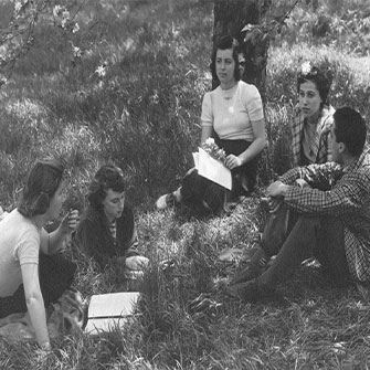 Photo of students on campus lawn.